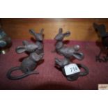 A set of four cast iron mice ornaments