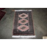 An approx. 3' x 2'1" Eastern patterned rug