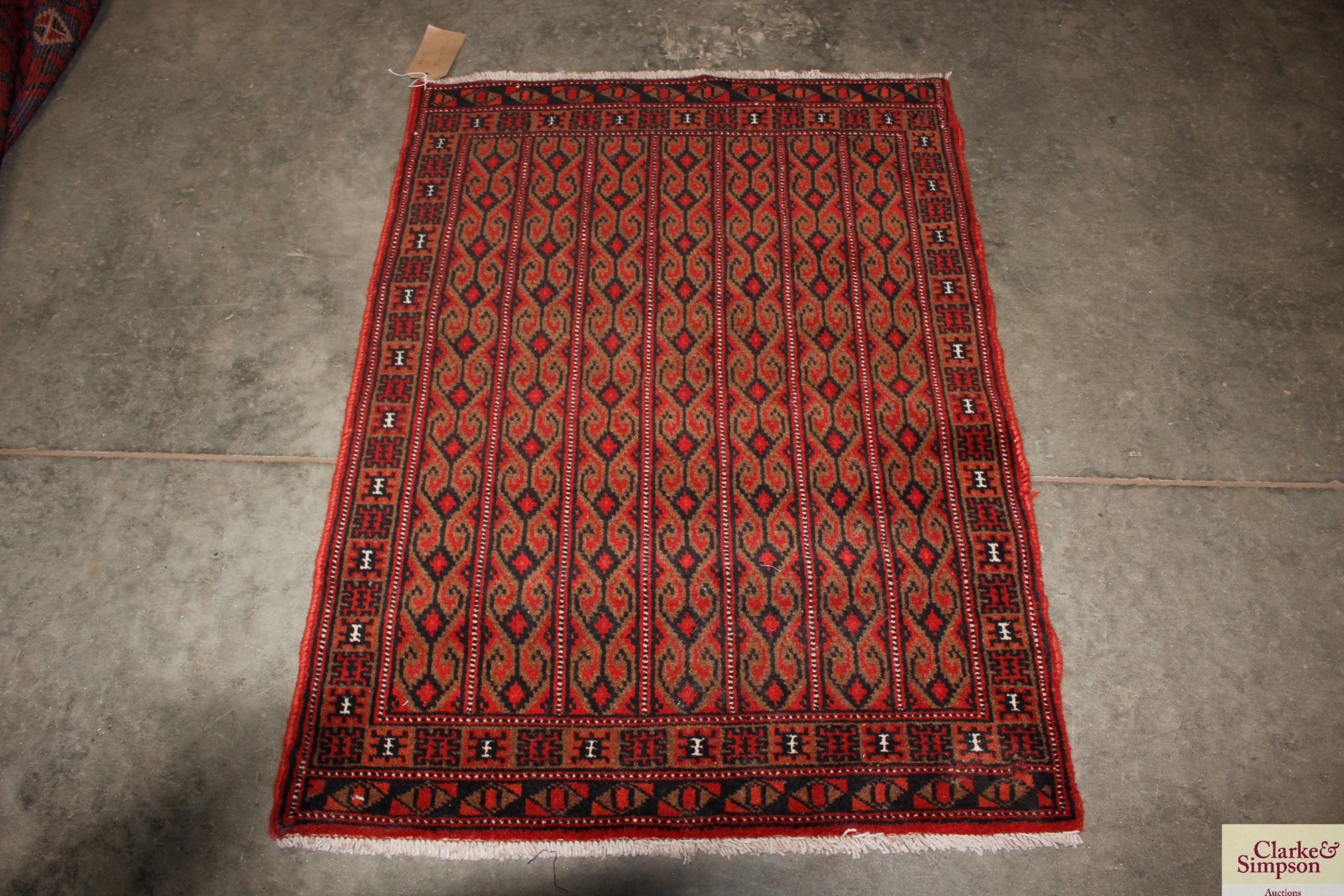 An approx. 106cm x 77cm red and black Eastern patt