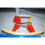 A child's wooden rocking horse