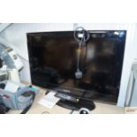 A Samsung flat screen television with remote contr