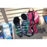 A pair of Dynafit ski boots, gloves and carrying b