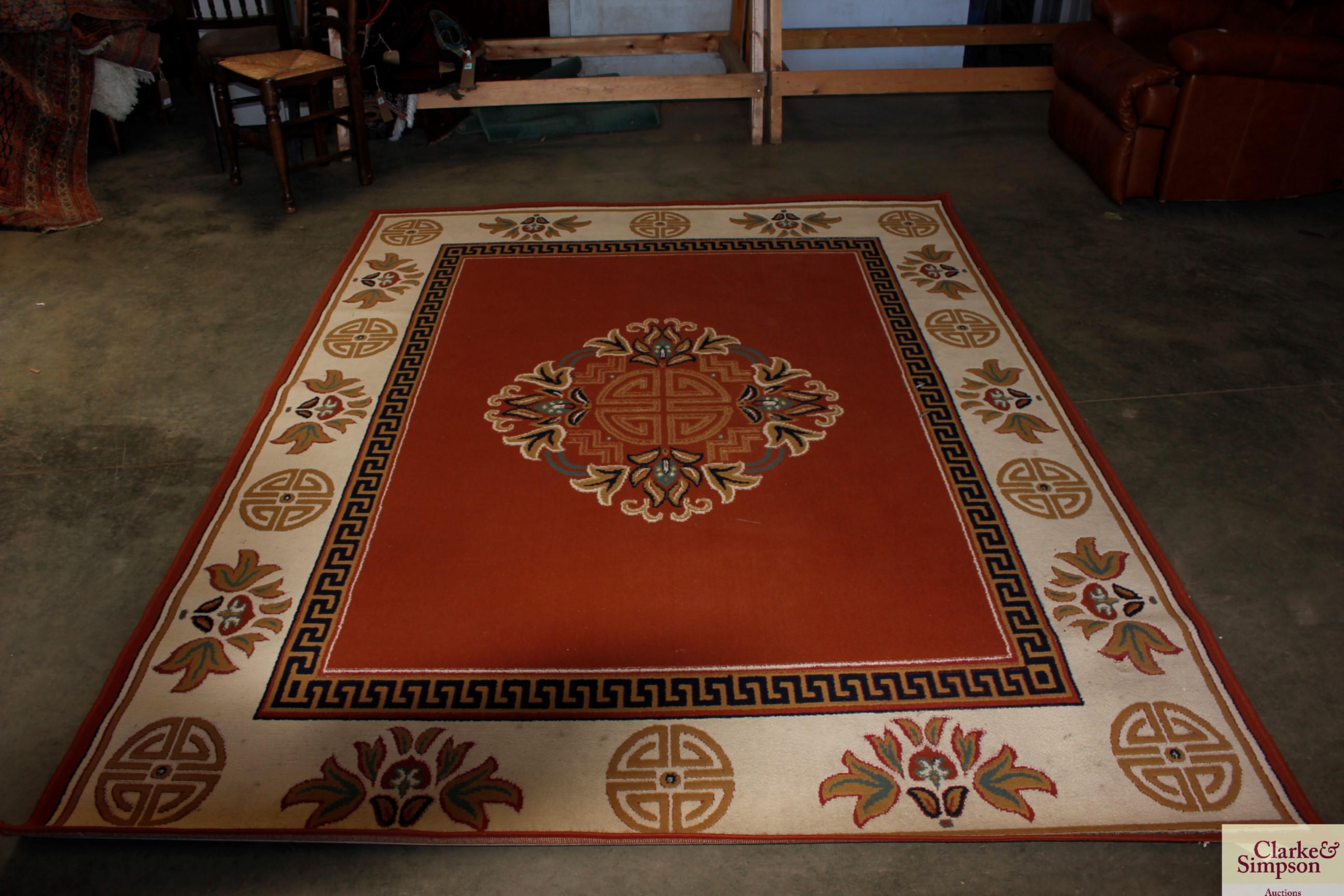 An approx. 8'10" x 6'7" Greek key patterned rug