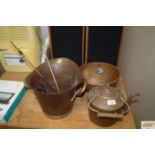 A copper bowl; a copper vessel; a twin handled bra