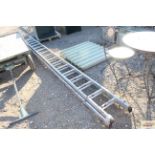 A long aluminium extending ladder