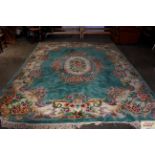 An approx. 12'4" x 9' Chinese wool rug