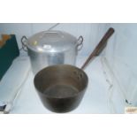 A brass pan together with a aluminium cooking dish