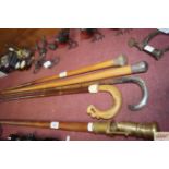 Four various antique walking canes