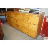 A large oak multi drawer sideboard