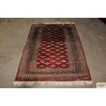 An approx. 4'2" x 6' Eastern floral patterned rug