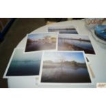 A pack of various unframed prints