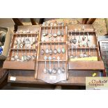 Three souvenir spoon racks and contents to include