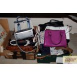 Two boxes containing various ladies handbags and p