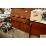 An Edwardian bureau fitted single drawer