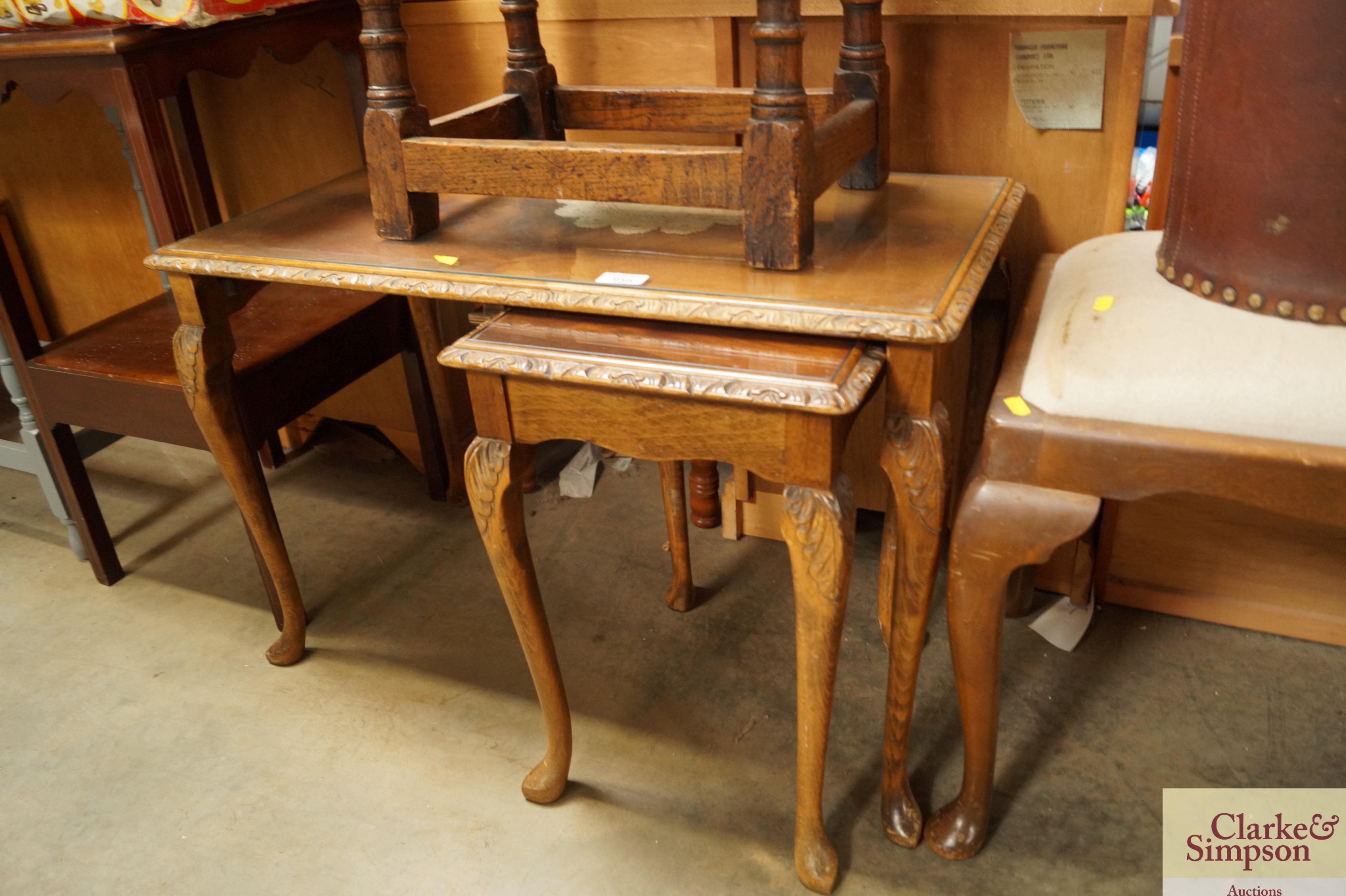 Two walnut glassed topped occasional tables