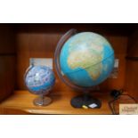 A illuminating world globe with one other