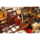 A set of four late Victorian carved oak dining cha