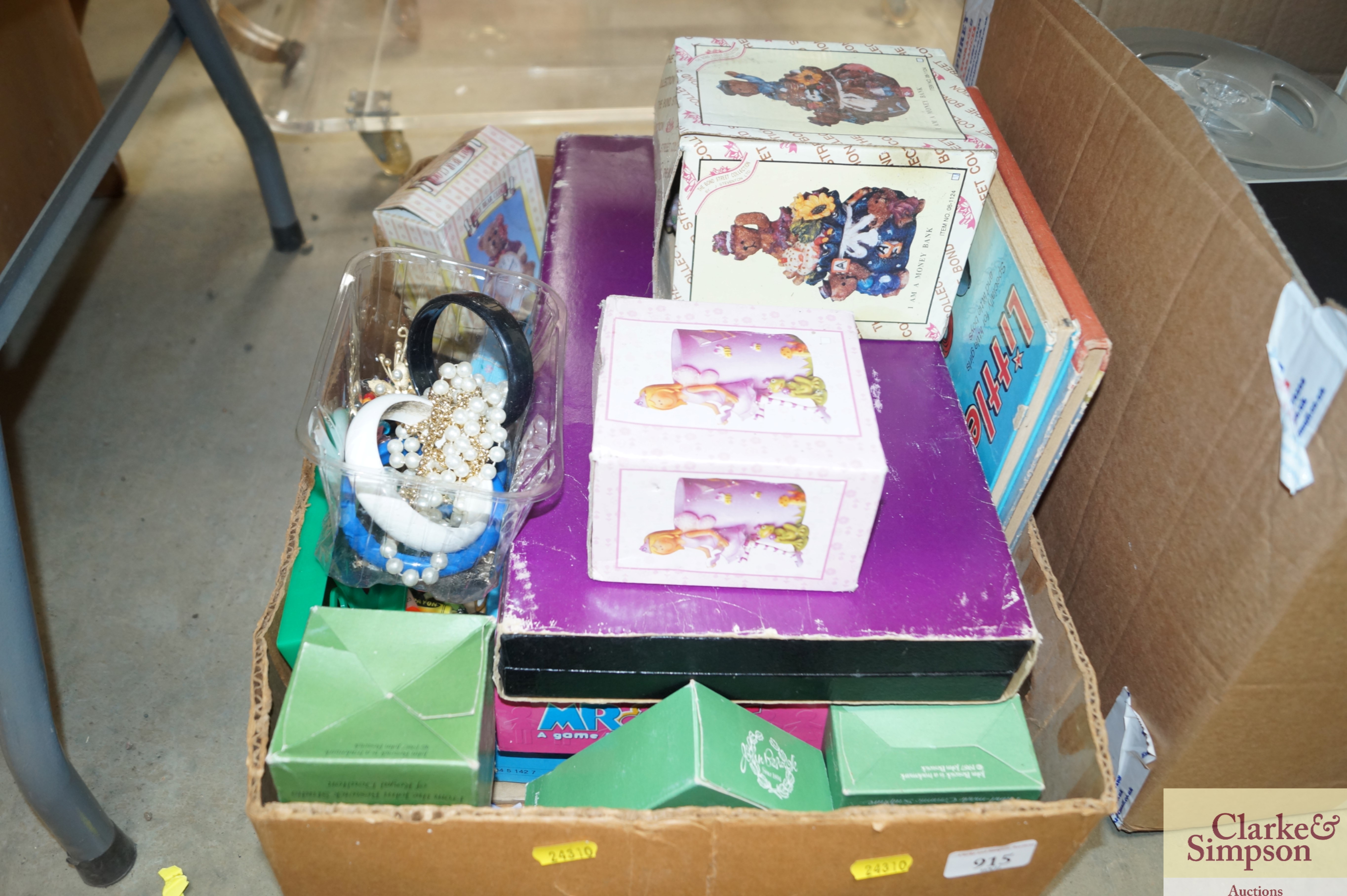 A box containing various games, money banks etc.