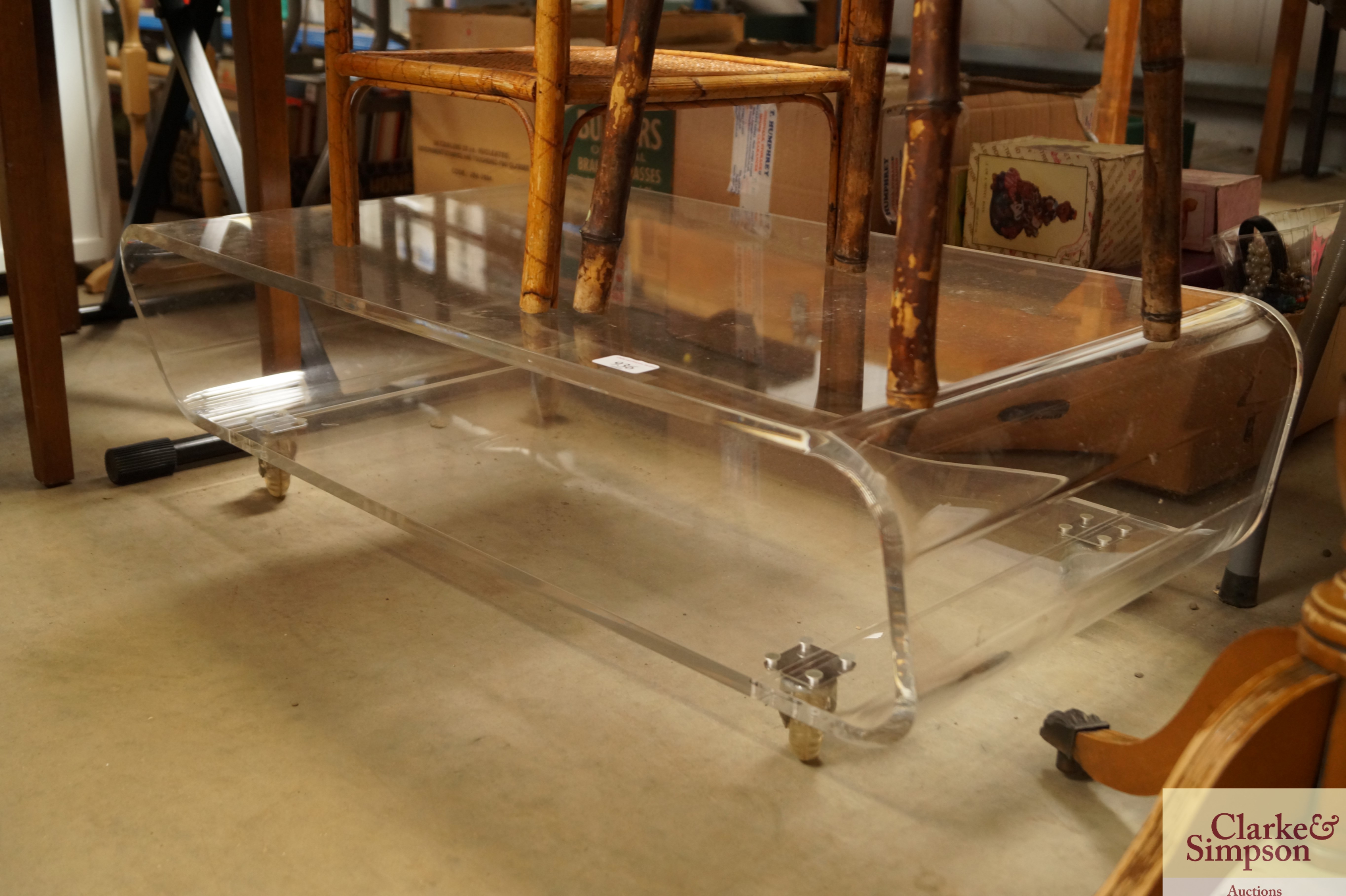 A clear Perspex TV stand