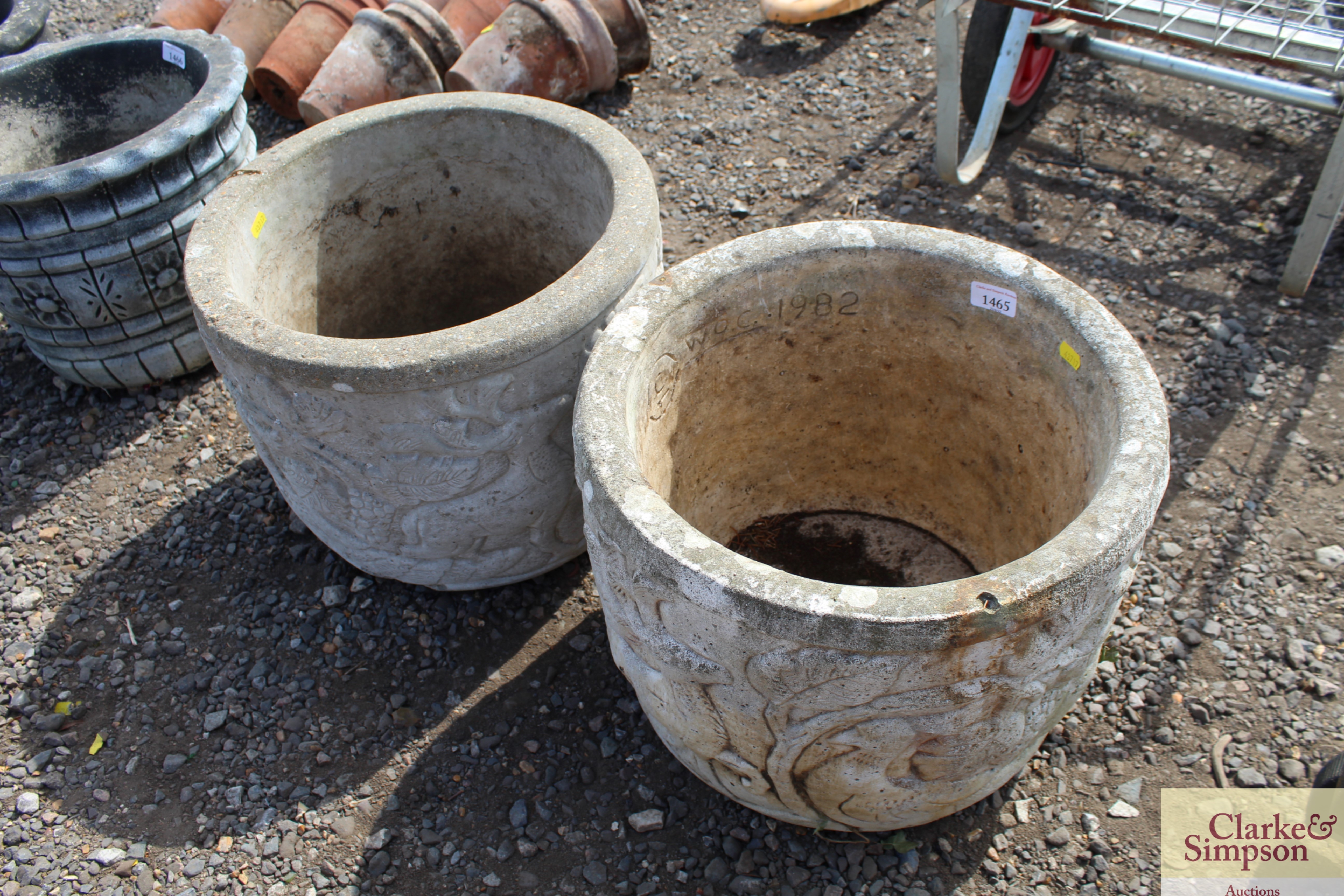A pair of decorated garden planters