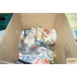 A box containing various napkins, playing cards et