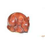 A wooden Netsuke in the form of a rat