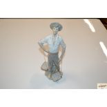 A Lladro figure in the form of a Fisherman