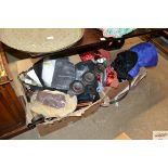 Two boxes containing various horse tack and horse