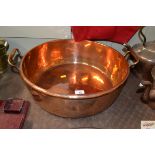 A polished copper jam pan