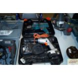 A Black & Decker cordless drill with battery charg