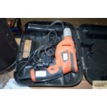 A Black & Decker hammer drill in fitted case
