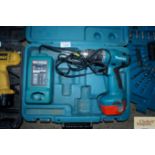 A Makita cordless drill and charger in fitted case