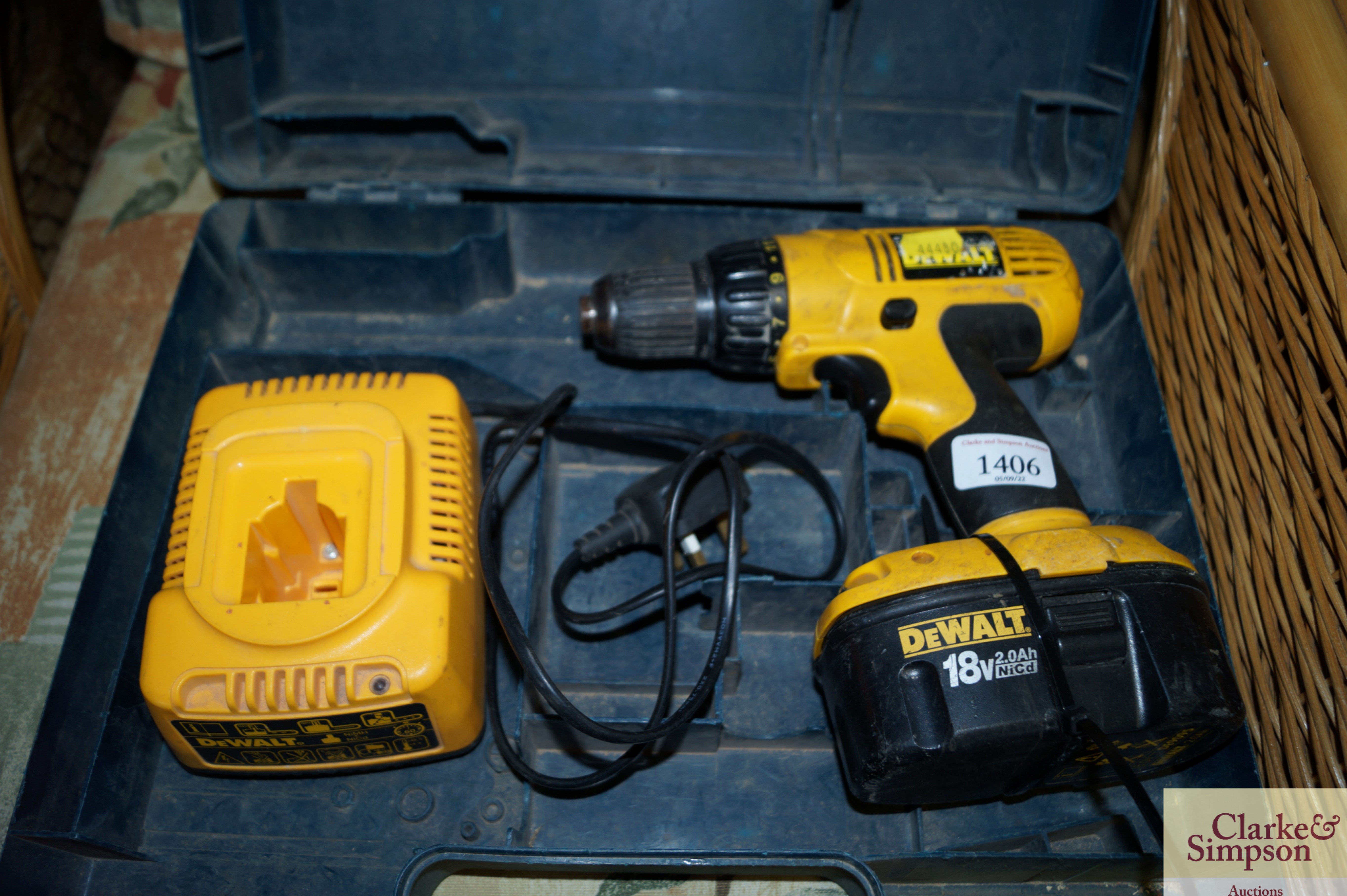 A Dewalt cordless drill with charger