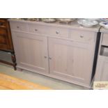 A painted sideboard fitted four drawers