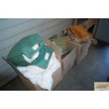 Three boxes containing various bedding, curtains a