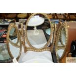 A gilt framed triptych mirror