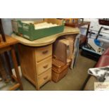 A kidney shaped dressing table fitted six drawers