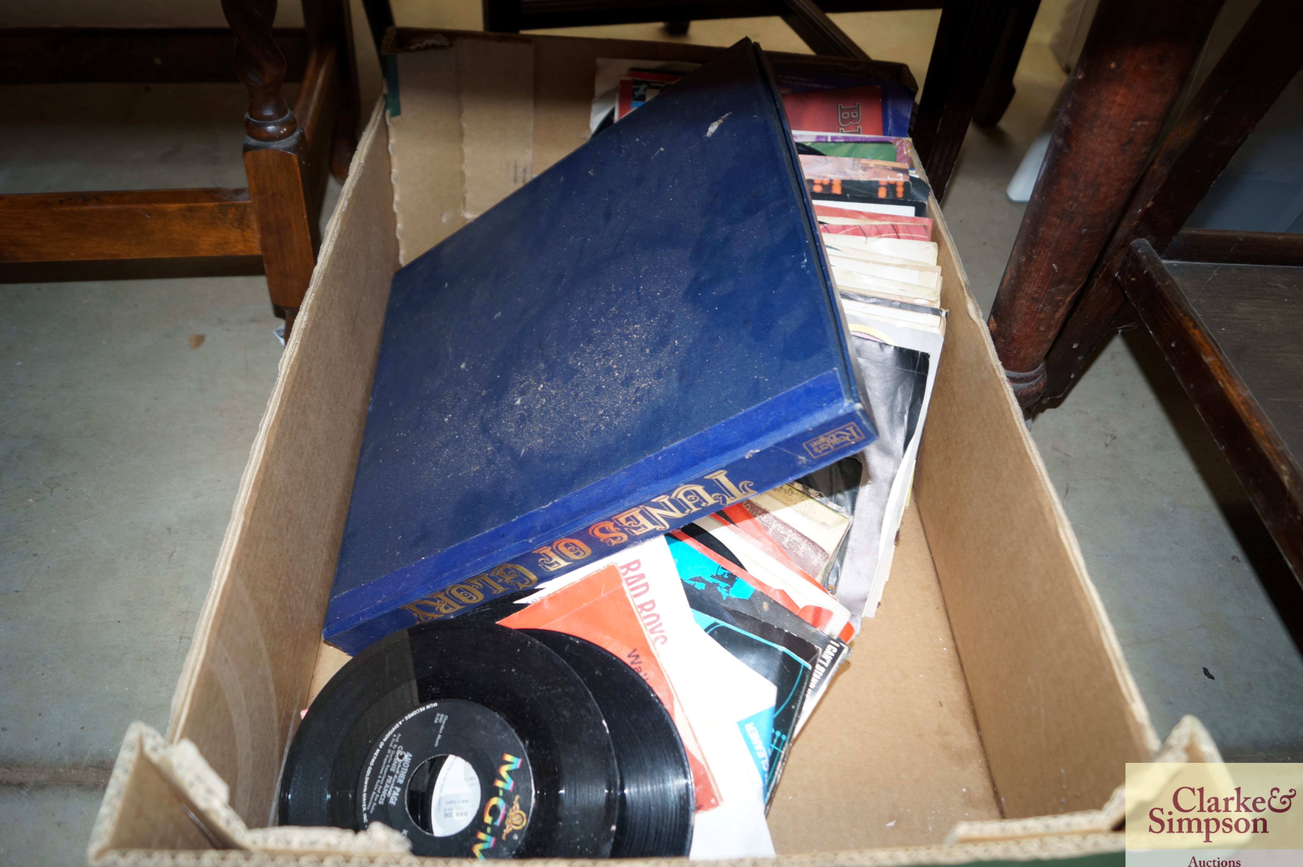 A box containing various LP's