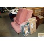 An upholstered armchair together with a matching f