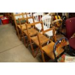 A set of four folding chairs