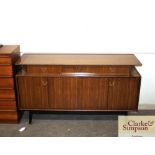 A teak G-plan sideboard fitted three raised drawer