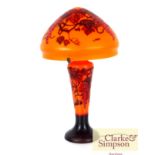 A Gallé style table lamp with fine decoration to the shade and body on an orange ground, 56cm high
