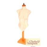 A silk covered tailors dummy on adjustable stand