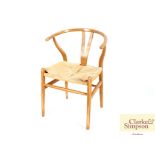 A bentwood style lightwood rush seated elbow chair