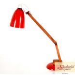 A 1950's red metal and wood angle poise lamp