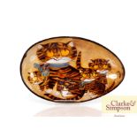 An oval pottery dish with cat decoration, impress
