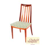 A set of four G-plan rail back teak dining chairs