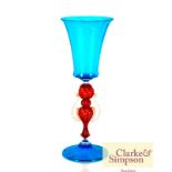 A Venetian blue glass goblet having a central ruby