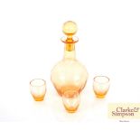 An amber glass decanter and three Liqueur glasses