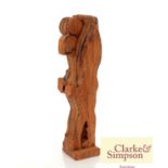 An unusual carved wooden stylised figure with blue